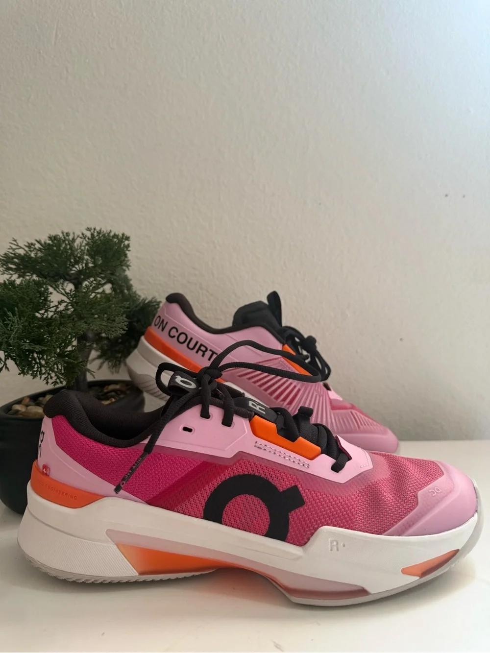 On the Roger pro fire men size 9  or women size 10 pink and Orange Men's Athleti
